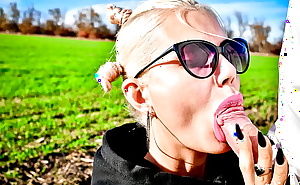 Adorable cutie sucks my dick in the middle of a field and gets cum in her mouth