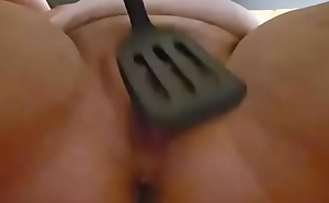 Slapping pussy with spatula