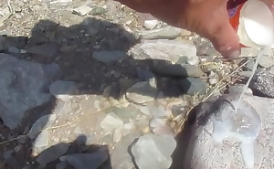 POURING A SHOTGLASS FULL OF CUM OVER THE ROCKS