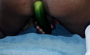 Deep fucking with a cucumber