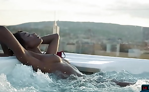 Ebony beauty from Cameroon Mimi Desuka gets naked in a pool for Playboy