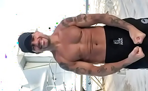 THE PORN STAR CHAMPION MODELING SWIM TRUNKS AT THE BEACH