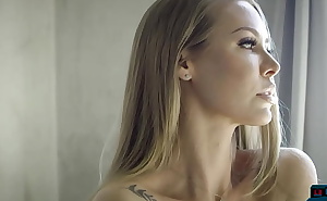 Hot MILF blonde Nicole Aniston gives a sensual striptease for Playboy