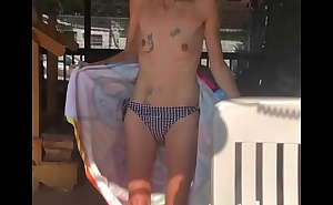 Skinny tattooed granny taking her bathing suit off