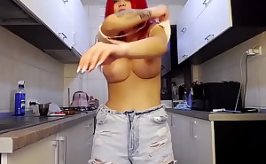 redhead with big boobs in her kitchen