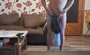 Striptease with a towel and a sock on a cock