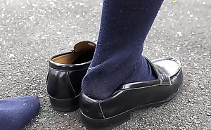 walking with her heel on her shoe