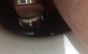 Another peeing in the metal chastity cage. Video report for my mistress who locked me in this chastity belt till the weekend.
