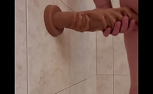 two hands and a cock dildo standing