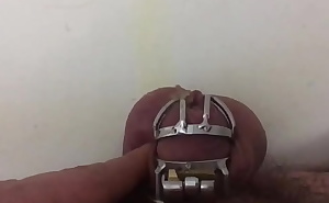 It is a terribly hard thing to pee wearing the small chastity cage at the uncut penis. Another video report made for my cruel mistress.