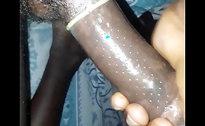 Kenyan boy dick in a condom feeling very horny at home