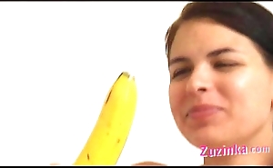 How-to: juvenile unilluminated girl teaches using a banana